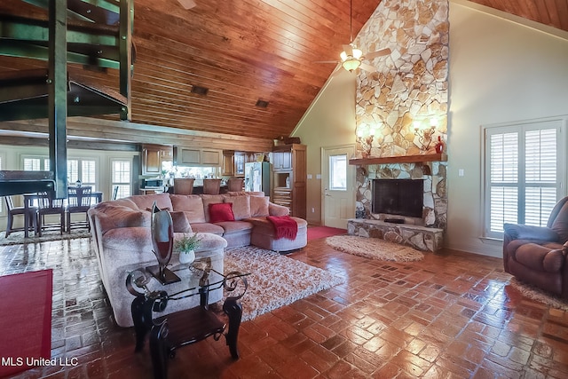 2276 Twin Creek Rd, Lucedale, MS 39452 - living room featuring high vaulted ceiling, a ceiling fan, a fireplace, wooden ceiling, and brick floors