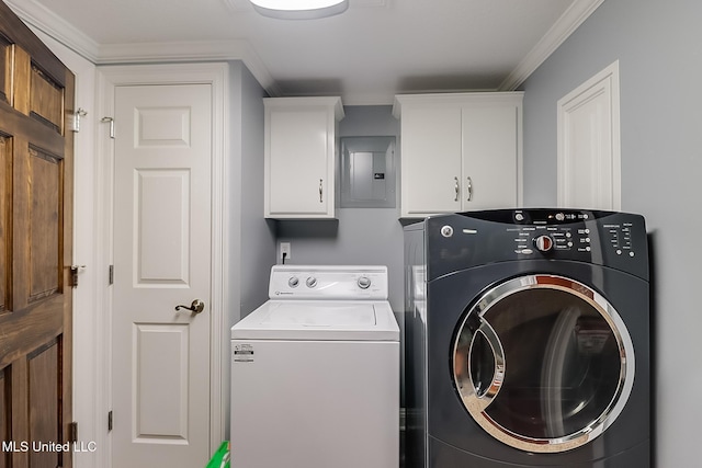 clothes washing area with cabinets, washer and dryer, electric panel, and ornamental molding