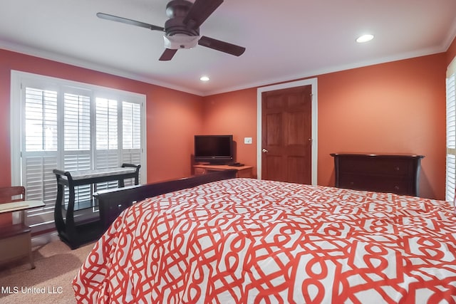 bedroom with ceiling fan, ornamental molding, and carpet floors