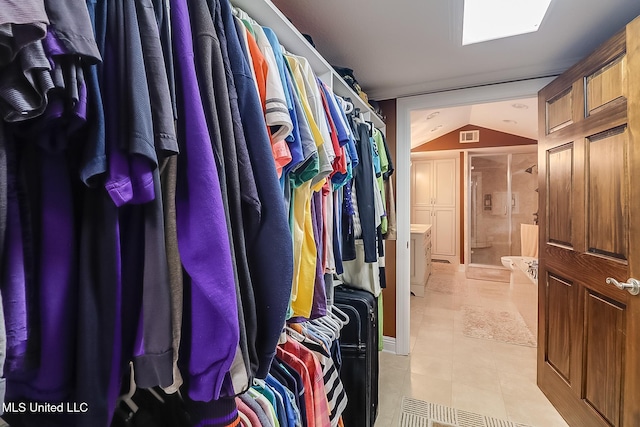 2276 Twin Creek Rd, Lucedale, MS 39452 - walk in closet featuring vaulted ceiling and light tile patterned flooring