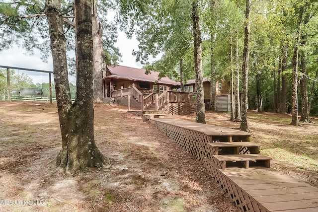 view of yard featuring a wooden deck