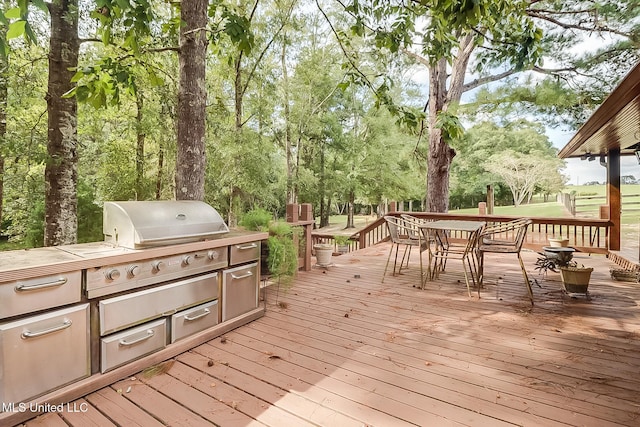 2276 Twin Creek Rd, Lucedale, MS 39452 - deck with outdoor dining area and an outdoor kitchen