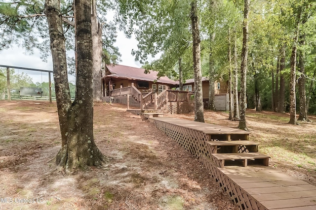 2276 Twin Creek Rd, Lucedale, MS 39452 - view of yard featuring a wooden deck and stairs