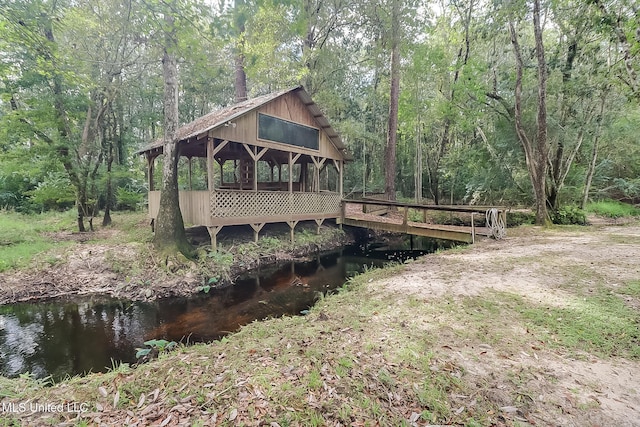 2276 Twin Creek Rd, Lucedale, MS 39452 - back of house with a deck and a wooded view