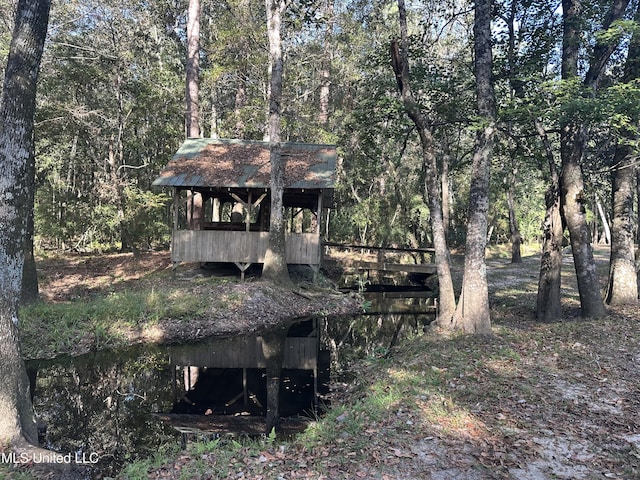 2276 Twin Creek Rd, Lucedale, MS 39452 - view of outdoor structure featuring a wooded view