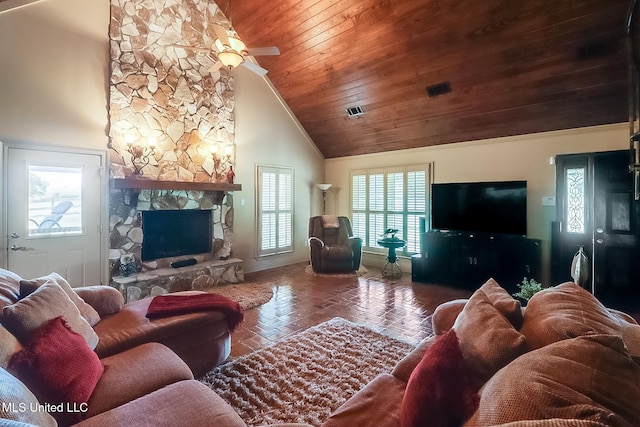 living room with a healthy amount of sunlight, high vaulted ceiling, wooden ceiling, and a fireplace