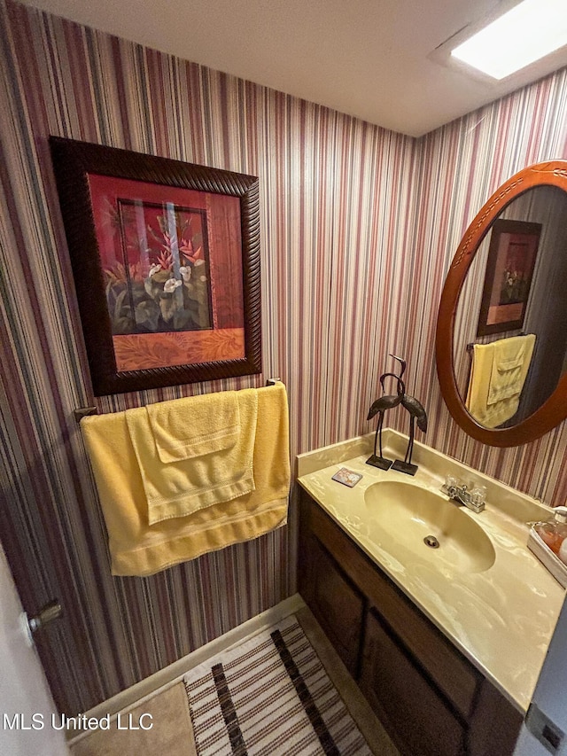 342 Lakebend Dr, Brandon, MS 39042 - bathroom featuring wallpapered walls and vanity