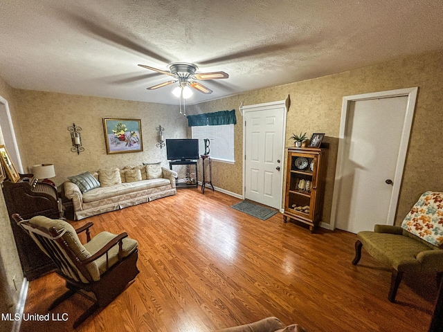 342 Lakebend Dr, Brandon, MS 39042 - living room with wood finished floors, ceiling fan, and a textured ceiling
