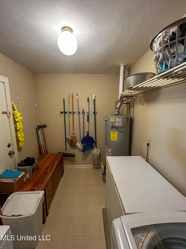 342 Lakebend Dr, Brandon, MS 39042 - washroom featuring light flooring, water heater, washing machine and clothes dryer, and a textured ceiling