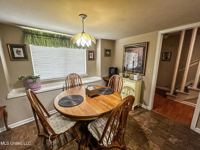 342 Lakebend Dr, Brandon, MS 39042 - dining area featuring a textured ceiling and baseboards