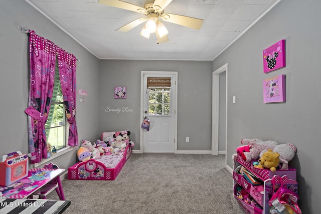 playroom featuring carpet and ceiling fan