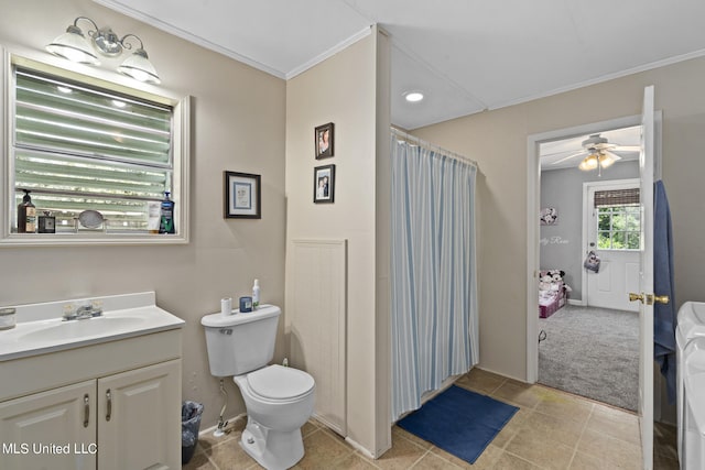 bathroom with toilet, tile patterned flooring, ornamental molding, vanity, and ceiling fan