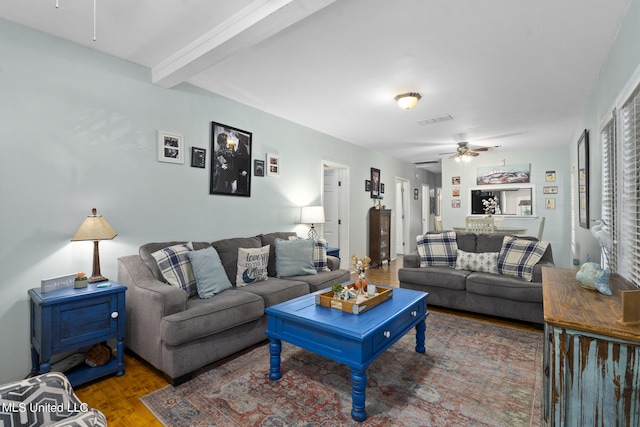 living room with beam ceiling, dark hardwood / wood-style floors, and ceiling fan