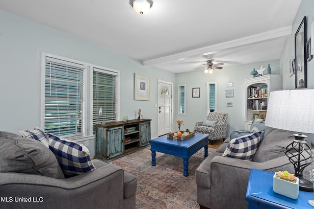 living room with ceiling fan and beamed ceiling