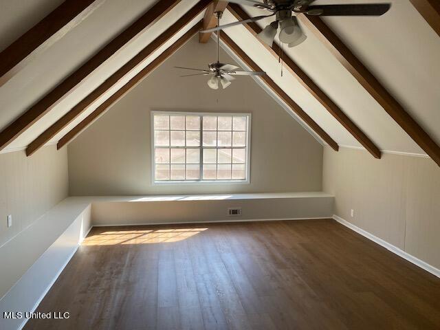 bonus room featuring ceiling fan, vaulted ceiling with beams, and dark hardwood / wood-style flooring