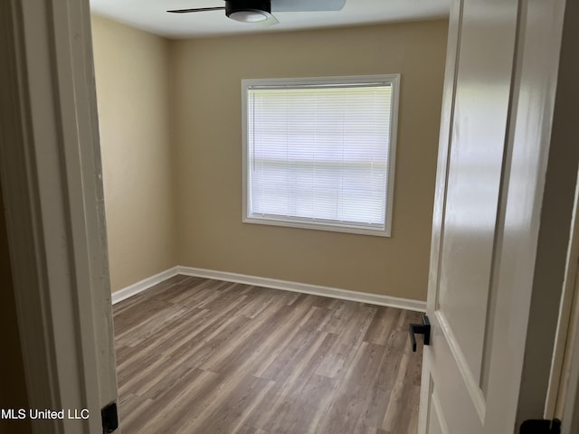 7701 Harold Ave, Moss Point, MS 39563 - spare room with a ceiling fan and wood finished floors