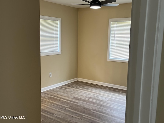 7701 Harold Ave, Moss Point, MS 39563 - empty room with a ceiling fan and wood finished floors