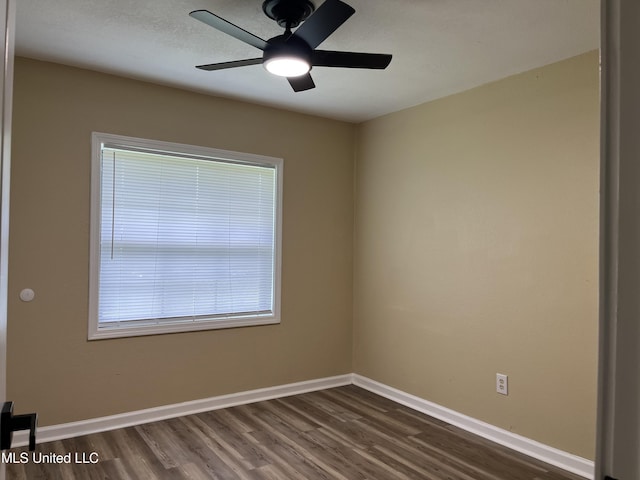 7701 Harold Ave, Moss Point, MS 39563 - spare room with dark wood finished floors and ceiling fan