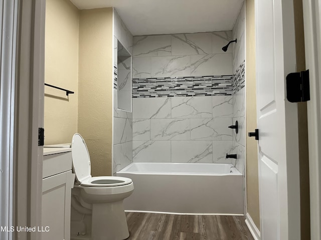 7701 Harold Ave, Moss Point, MS 39563 - full bathroom featuring wood finished floors, vanity, and shower / tub combination