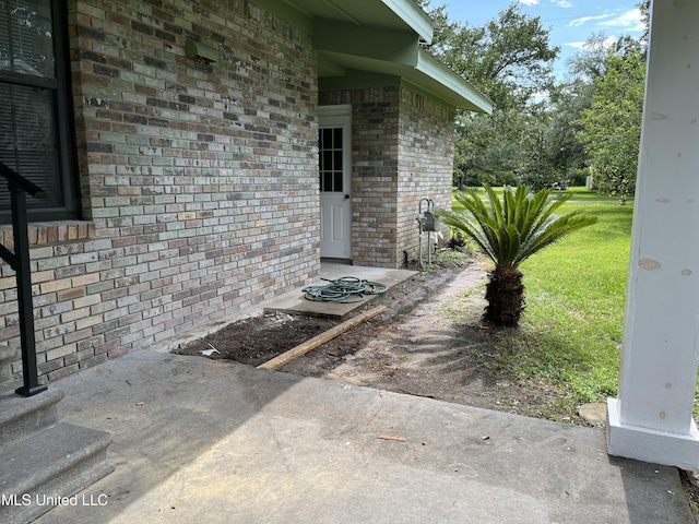 7701 Harold Ave, Moss Point, MS 39563 - property entrance featuring brick siding