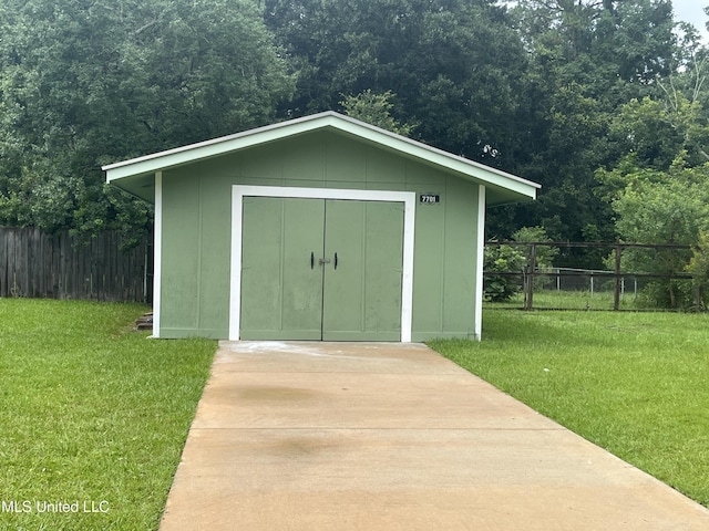 7701 Harold Ave, Moss Point, MS 39563 - view of shed featuring a view of trees