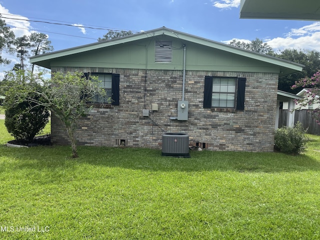 7701 Harold Ave, Moss Point, MS 39563 - view of home's exterior featuring a central AC unit