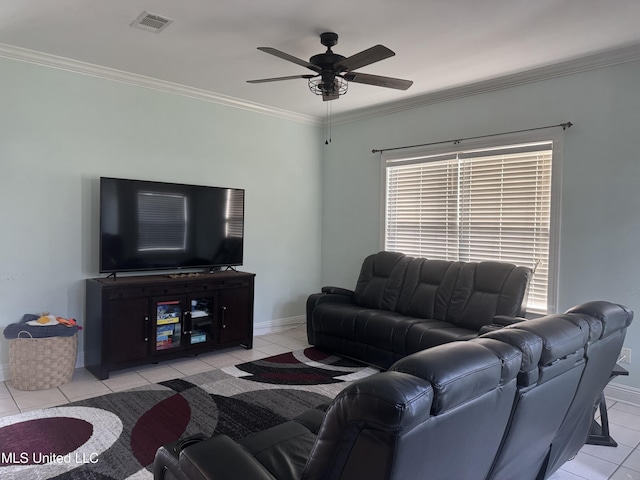 living area with light tile patterned flooring, baseboards, ceiling fan, and ornamental molding