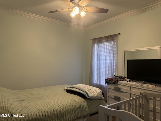 bedroom featuring crown molding and a ceiling fan