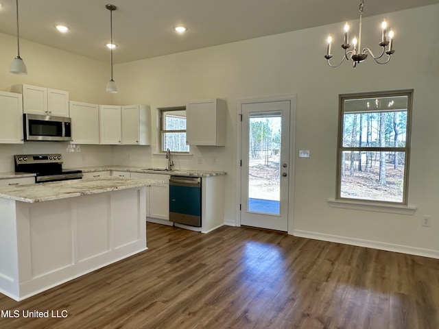 kitchen featuring appliances with stainless steel finishes, white cabinetry, and dark wood-style floors