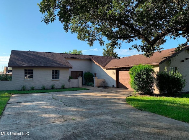 single story home featuring a garage