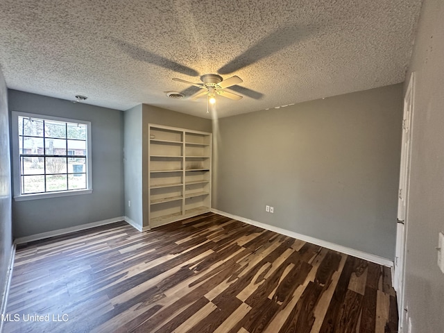 unfurnished bedroom featuring dark hardwood / wood-style flooring, a closet, and a textured ceiling