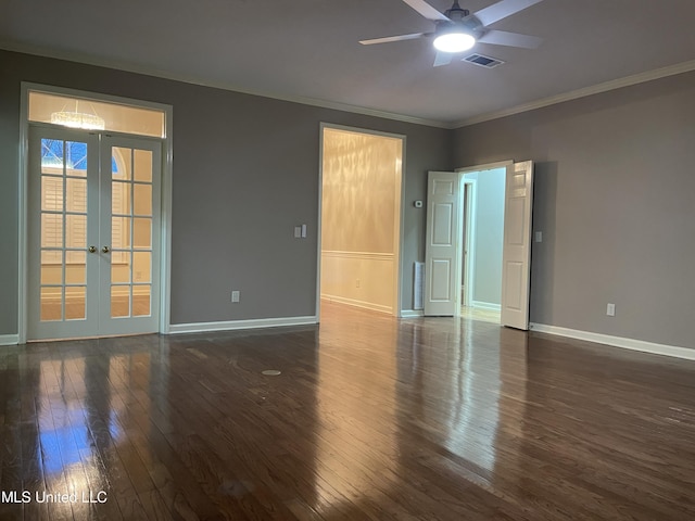 empty room with french doors, crown molding, ceiling fan, and dark wood-type flooring