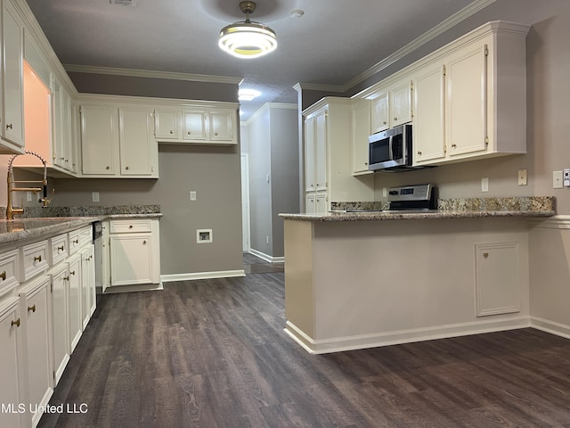 kitchen with white cabinets, ornamental molding, sink, stone counters, and dark hardwood / wood-style floors