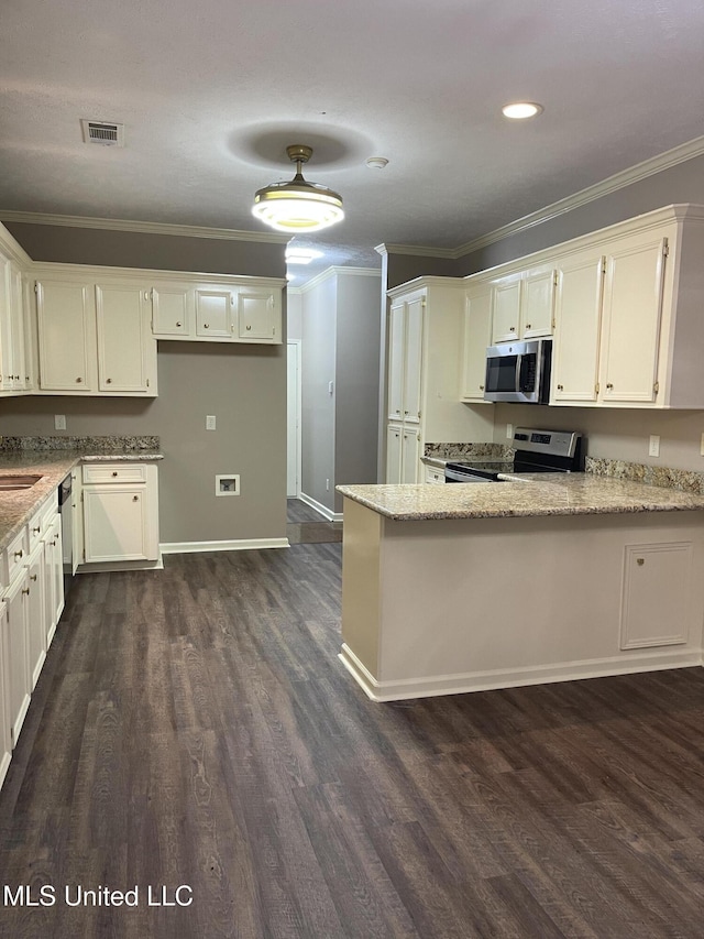 kitchen featuring kitchen peninsula, dark hardwood / wood-style floors, white cabinetry, and stainless steel appliances