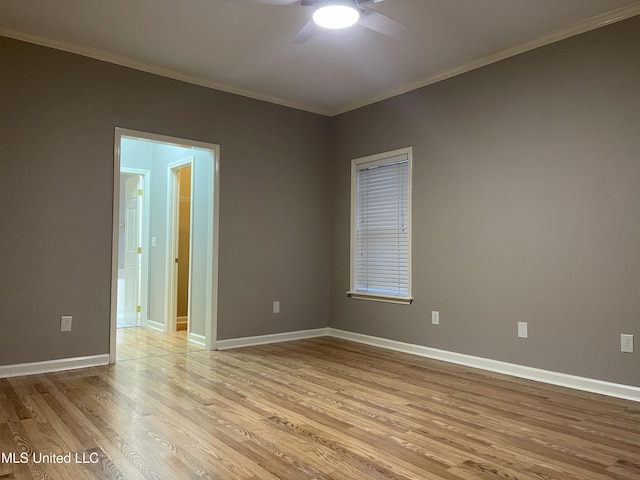 empty room with ceiling fan, light wood-type flooring, and ornamental molding