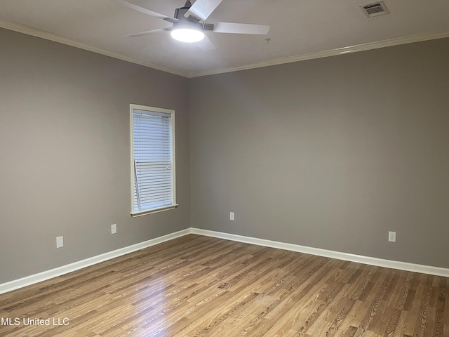 spare room with light hardwood / wood-style flooring, ceiling fan, and ornamental molding