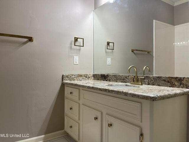 bathroom with tile patterned flooring and vanity