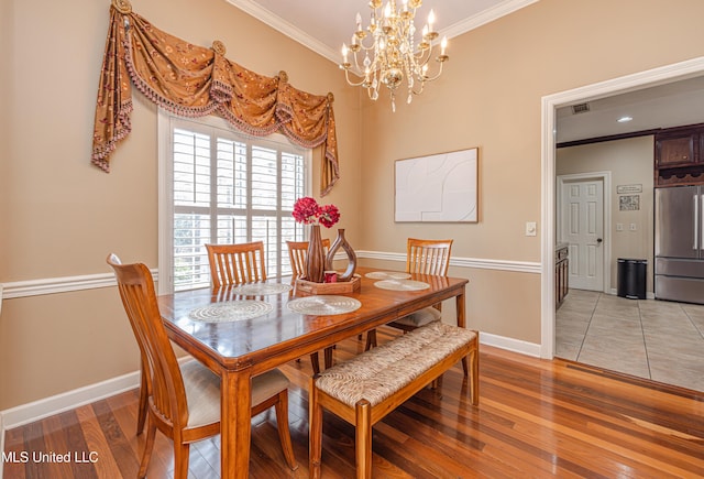 116 Hidden Hills Dr, Madison, MS 39110 - dining room featuring ornamental molding, light wood finished floors, and a chandelier