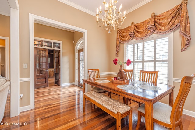 116 Hidden Hills Dr, Madison, MS 39110 - dining room with crown molding, a chandelier, and light wood finished floors