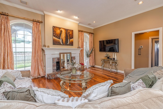 116 Hidden Hills Dr, Madison, MS 39110 - living room featuring wood finished floors, a brick fireplace, crown molding, and recessed lighting