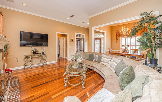 116 Hidden Hills Dr, Madison, MS 39110 - living area with wood finished floors, a chandelier, recessed lighting, and ornamental molding