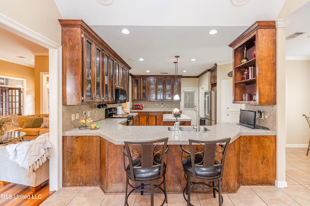 116 Hidden Hills Dr, Madison, MS 39110 - kitchen featuring stainless steel appliances, crown molding, a peninsula, recessed lighting, and glass insert cabinets