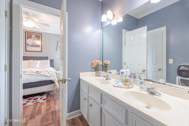 116 Hidden Hills Dr, Madison, MS 39110 - ensuite bathroom featuring crown molding, double vanity, wood finished floors, and a ceiling fan