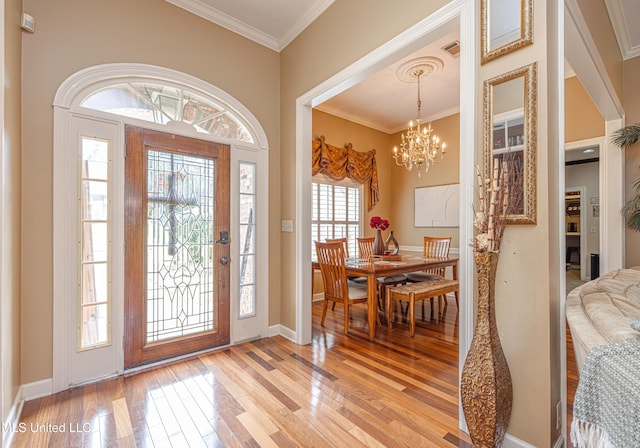 116 Hidden Hills Dr, Madison, MS 39110 - foyer entrance with light wood-style flooring, ornamental molding, and a chandelier