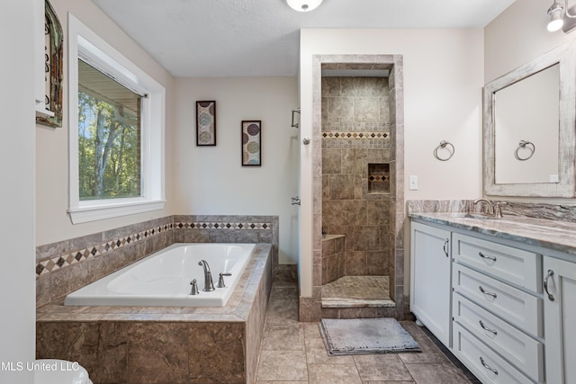 bathroom with separate shower and tub, tile patterned floors, and vanity