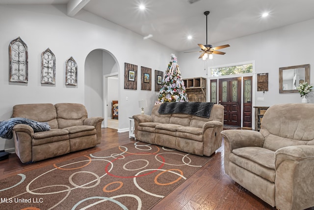 living room with beam ceiling, dark hardwood / wood-style floors, high vaulted ceiling, and ceiling fan