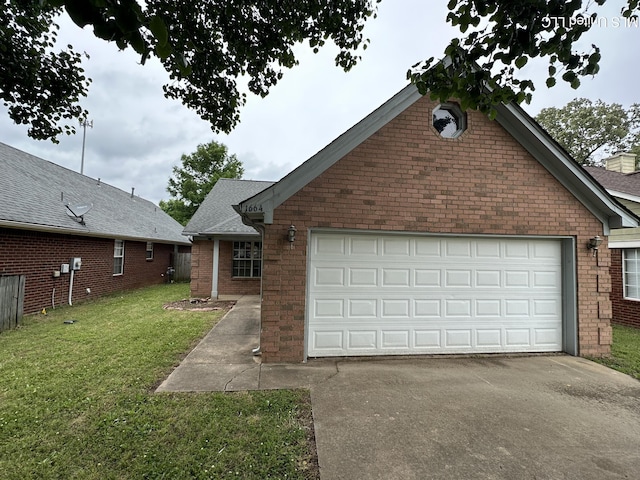 1664 Thomas St, Horn Lake, MS 38637 - view of front of property with concrete driveway, brick siding, a front lawn, and a garage