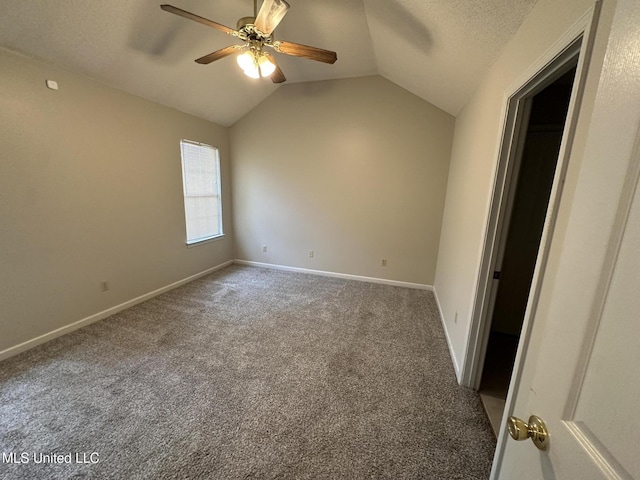 1664 Thomas St, Horn Lake, MS 38637 - carpeted spare room featuring vaulted ceiling, a ceiling fan, and baseboards