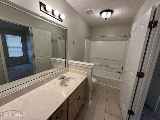 1664 Thomas St, Horn Lake, MS 38637 - full bath with toilet, a textured ceiling, vanity, tile patterned flooring, and shower / bath combination