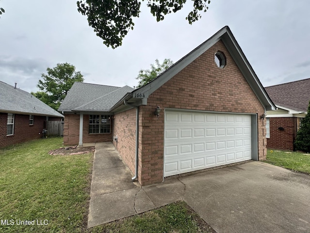1664 Thomas St, Horn Lake, MS 38637 - view of front of home with a shingled roof, a front lawn, brick siding, concrete driveway, and a garage